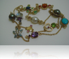 18 Carat yellow gold & palladium set with various gemstones (long necklace)